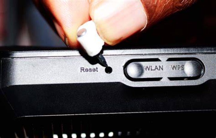 How do I use the reset button on my tablet?