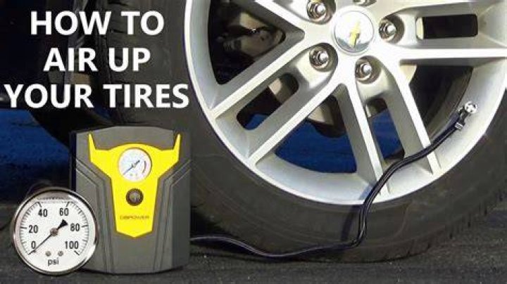 How do you inflate a tire with an air compressor?