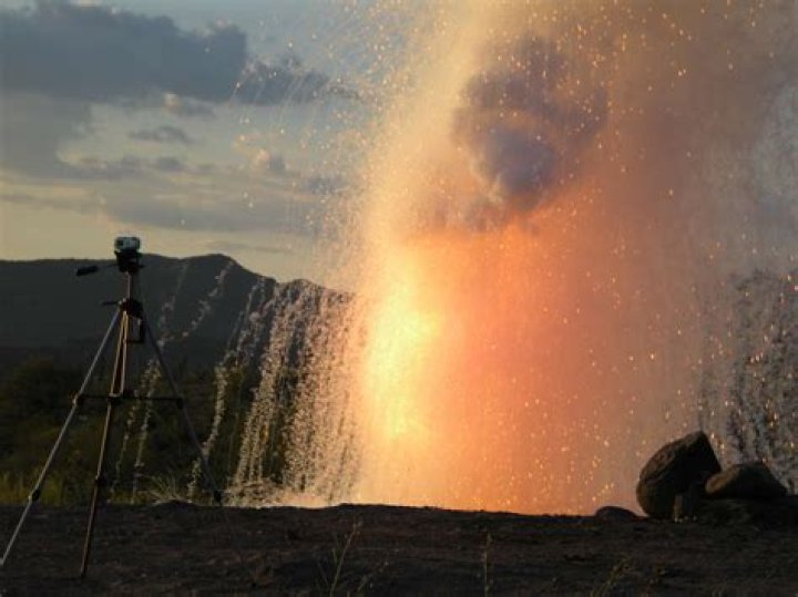 How does francium react with water?