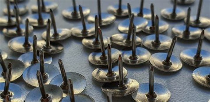 Who invented the thumb tacks?