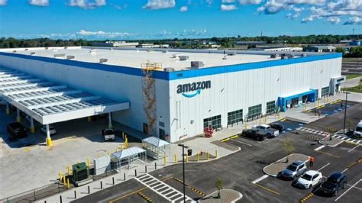 Why is Amazon building more warehouses as it grows and where should they be located?